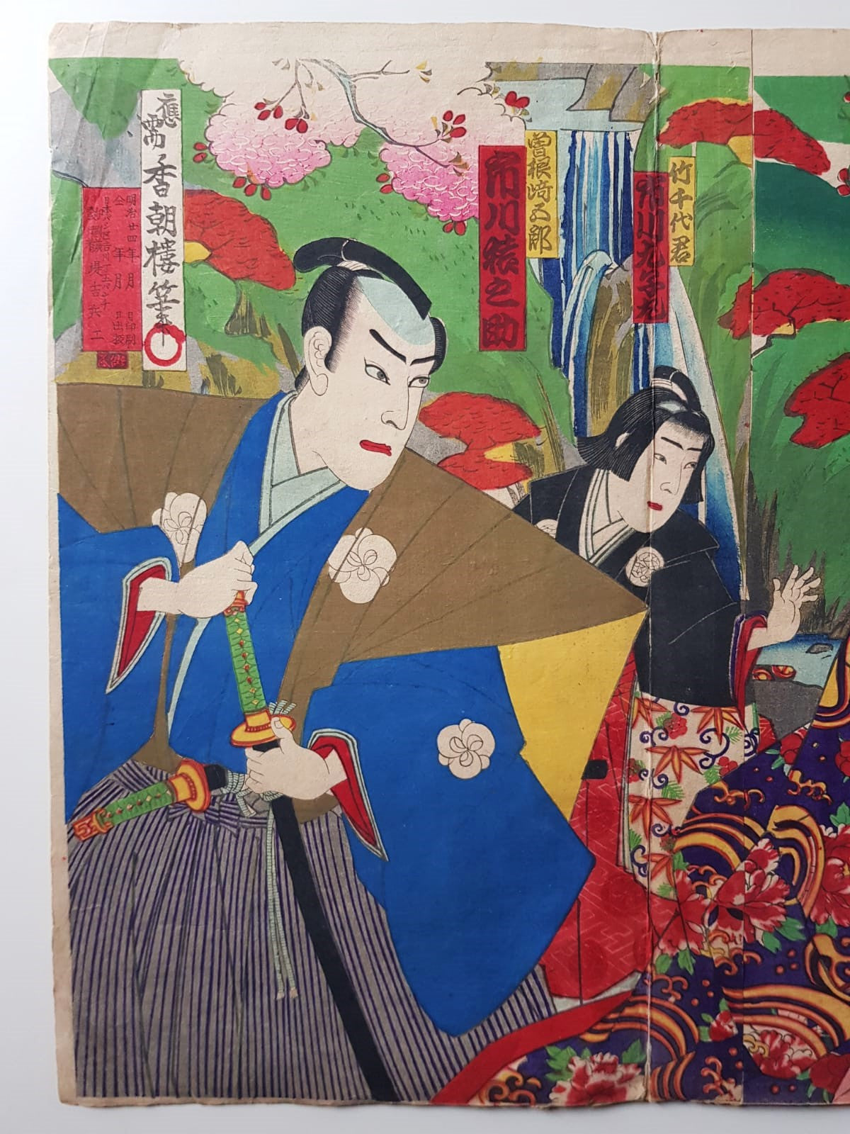 TOYOHARA KUNICHIKA (1835–1900) A Monumental Kabuki Ukiyo-e Triptych: A Scene of Dramatic Conflict beneath the blossoming trees, Japan, Meiji Period