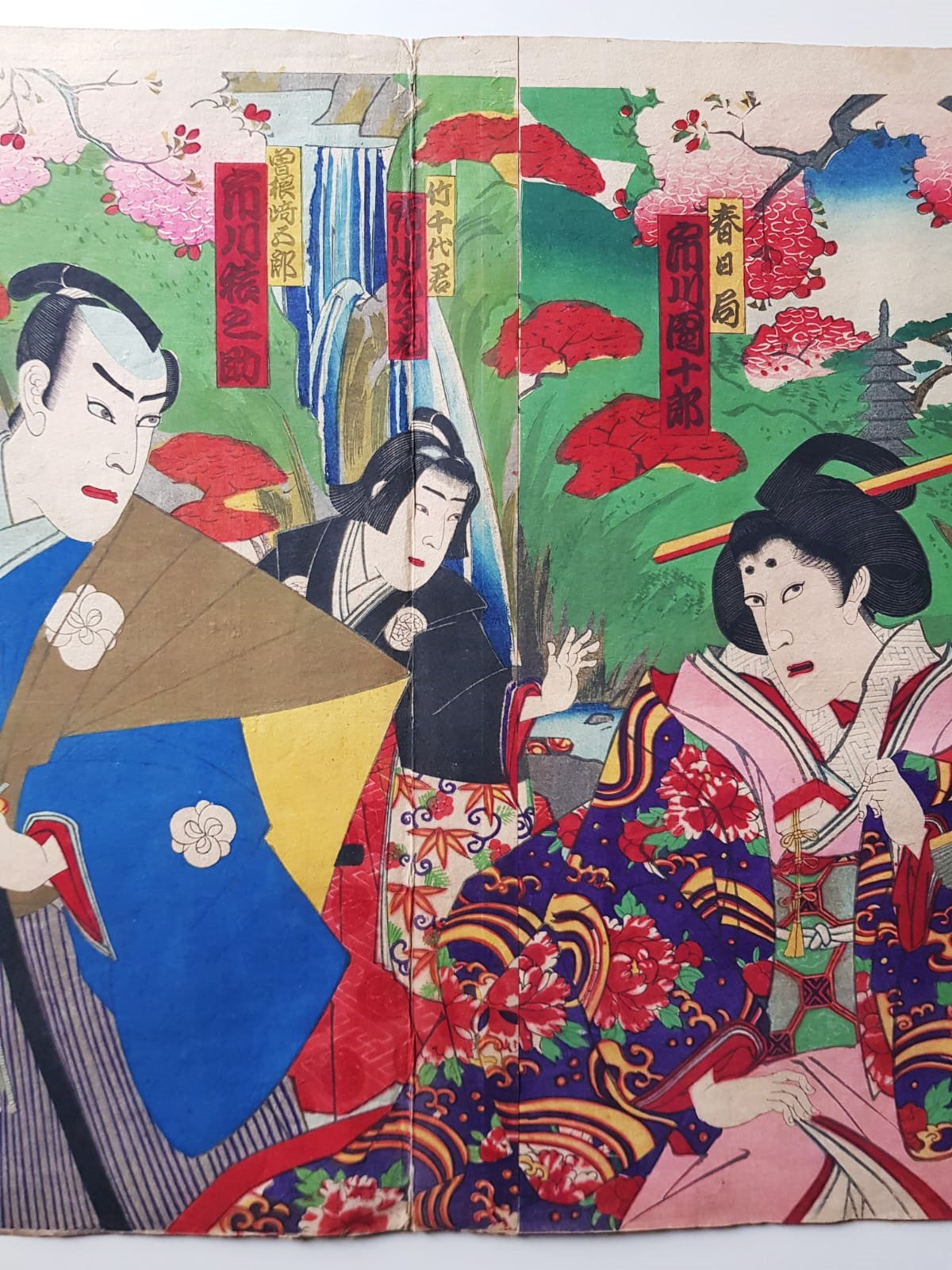 TOYOHARA KUNICHIKA (1835–1900) A Monumental Kabuki Ukiyo-e Triptych: A Scene of Dramatic Conflict beneath the blossoming trees, Japan, Meiji Period