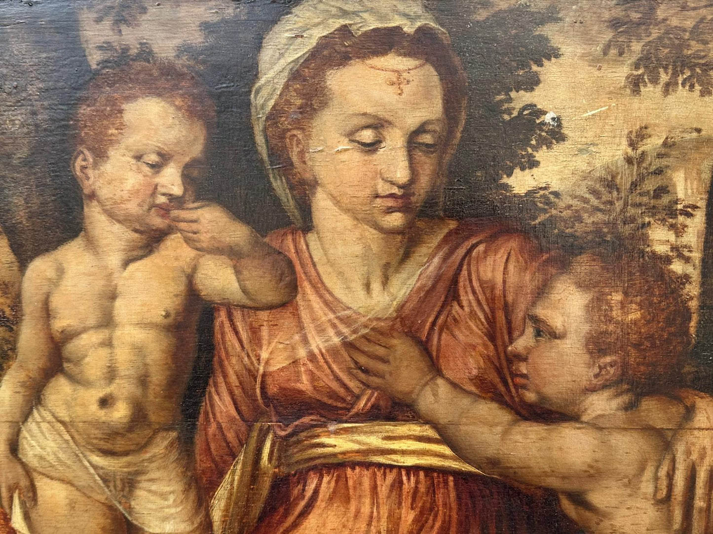 North European School, 16th Century, Oil on Panel, "Madonna and Child with Infant Figures in a Landscape"