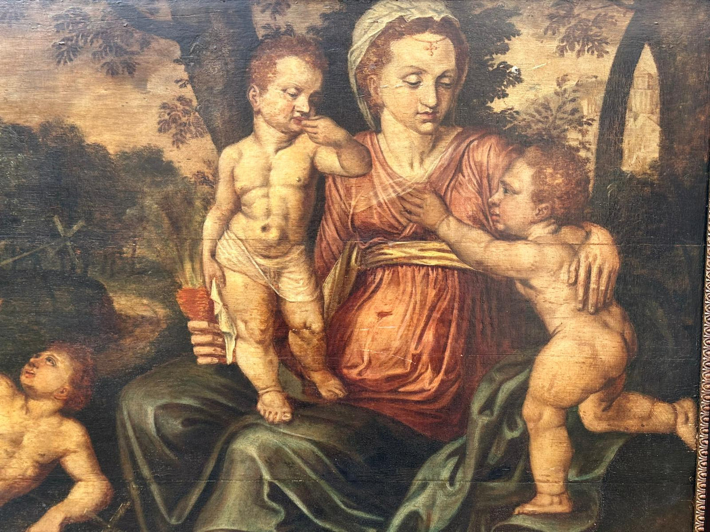 North European School, 16th Century, Oil on Panel, "Madonna and Child with Infant Figures in a Landscape"
